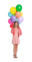 Emotional young woman holding bunch of colorful balloons on white background