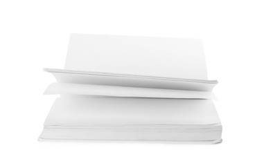 Open hardcover book with blank pages on white background