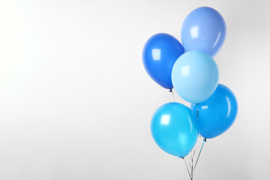 Bunch of blue balloons on white background. Greeting card