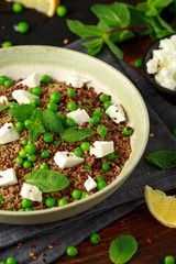 Quinoa salad with green pea, mint, feta cheese and chilli flake. healthy diet food