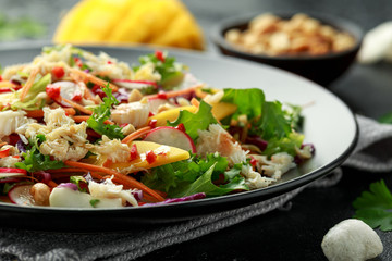 Crab salad with vegetables, radish, carrots, mango, pine nuts and prawn crackers