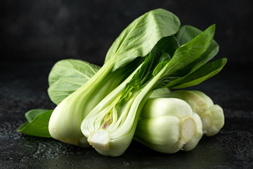 Pak Choi Chinese Cabbage on rustic black background