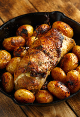 oven baked prune, rosemy and garlic stuffed pork fillet with baby potatoes