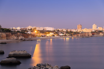 Fototapeta premium Sunset over the city of Algarve, Portugal.