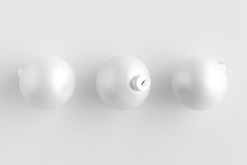 Top view of a three white matte christmas balls.