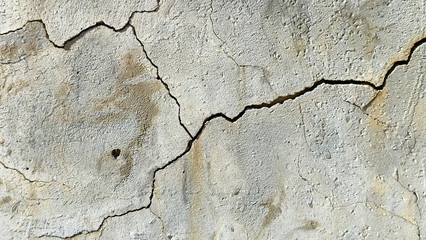  A crack on the concrete wall surface of a house in Los Angeles. Background image for design