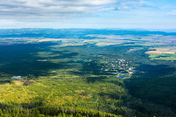 Town in the High Tatras - Tatranska Lomnica surrounded by a green forest. Tourist resort in the Tatra Mountains.