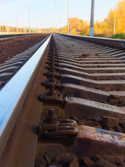 Perspective, railroad track with concrete sleepers, close-up, directed over the horizon. Travel concept