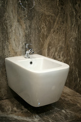 Toilet and bide bathroom isolated on black background.