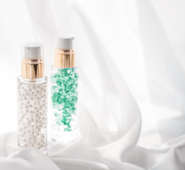 Skincare serum and make-up primer gel bottle, moisturizing lotion and lifting cream emulsion,...
