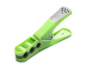 Green plastic clothespin isolated on white background