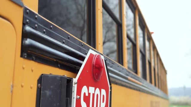 Close ups of yellow school bus on field trip.