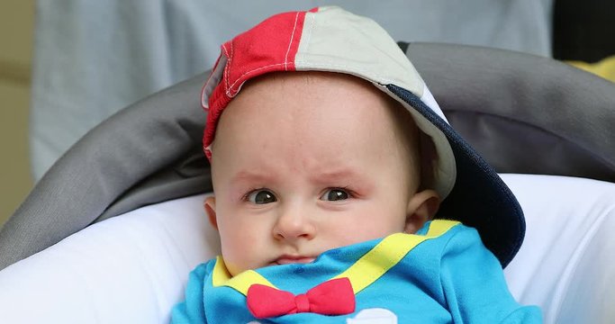 Cute Baby Boy Wearing A Cap Backwards