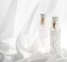 Skincare serum and make-up primer gel bottle, moisturizing lotion and lifting cream emulsion,...