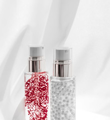 Skincare serum and make-up primer gel bottle, moisturizing lotion and lifting cream emulsion,...