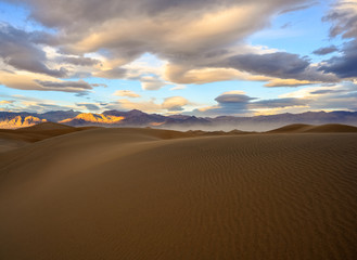 Plakat Sunset over sand dunes