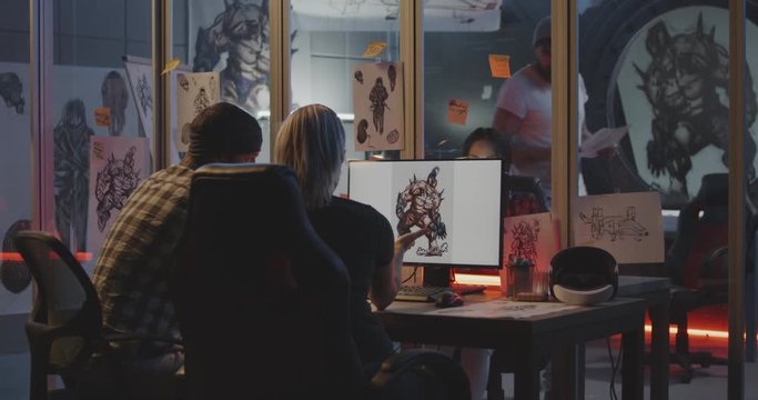 Developer team discussing game art