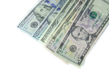 American dollars denominations of one hundred, fifty, five. Arranged in a chaotic manner, a short flight of stairs, a bill on a bill. Old sample and new notes. Dollars in hands are twisted into a tube