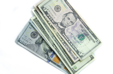 American dollars denominations of one hundred, fifty, five. Arranged in a chaotic manner, a short flight of stairs, a bill on a bill. Old sample and new notes. Dollars in hands are twisted into a tube