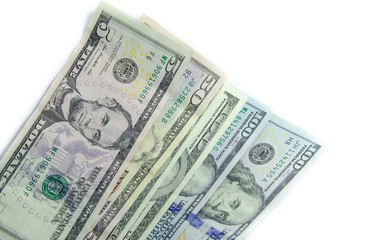 American dollars denominations of one hundred, fifty, five. Arranged in a chaotic manner, a short flight of stairs, a bill on a bill. Old sample and new notes. Dollars in hands are twisted into a tube