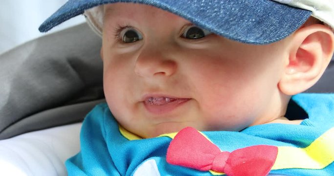 Portrait Of Baby Boy With Brown Eyes Drooling And Smiling
