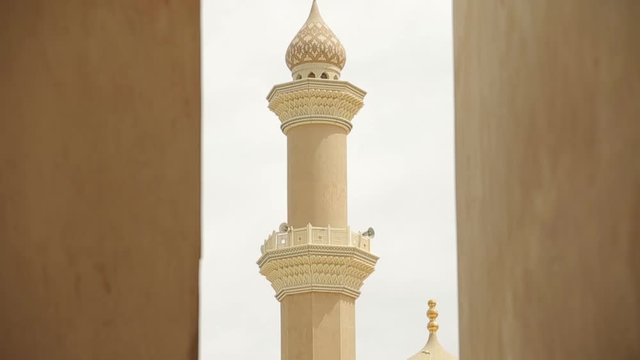 Nizwa Fort, Oman. Traditional Omani fortress, general plan and details. Panorama of the minaret