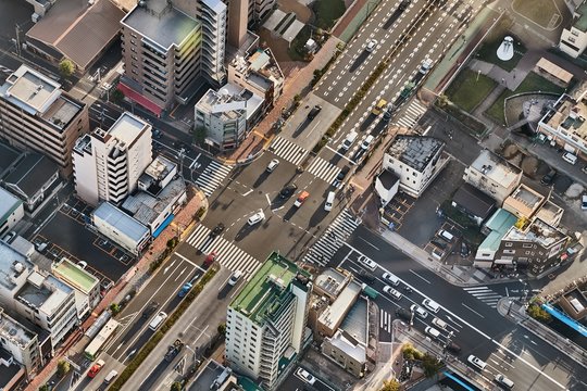 Urban Road Intersection From Above With Passing Cars, Aerial View