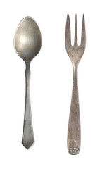 Vintage tea spoon and fork isolated on a white background. Retro silverware.