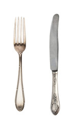 Beautiful old vintage fork and knife isolated on white background. Top view. Retro silverware