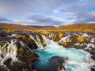 Fototapeta na wymiar Beautiful Bruarfoss waterfall with turquoise water in Iceland..