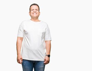 Fototapeta premium Middle age arab man wearig white t-shirt over isolated background with a happy and cool smile on face. Lucky person.