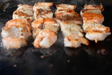 Sea food, salmon fish and shrimps barbecue.
