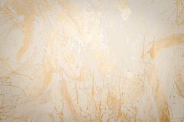 Gold or foil painting on grunge concrete and cement dirty for texture background.wall texture...