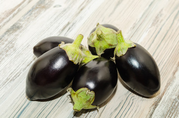Mini aubergine vegetable isolated on rustic background