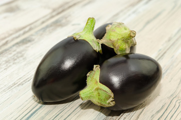 Mini aubergine vegetable isolated on rustic background
