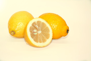 Fresh juicy lemon on a bright yellow background. 