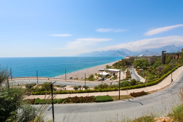 Fototapeta na wymiar The road along the beach. View of the Mediterranean Sea. View from above. Antalya, Turkey, April 6, 2019.