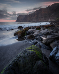  stones in the beach under the cloudy sky at sunset © ignasi