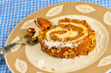 Closeup of Slice of Pumpkin Roll sprinkled with Powdered Sugar