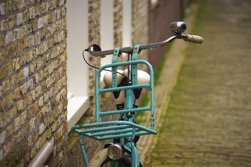 Fototapeta na wymiar Bicycle parked in a side street in Harlingen