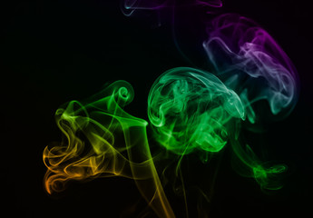 Colored blue smoke on a black background