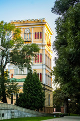 Beautiful old house and tower on a background of blue sky