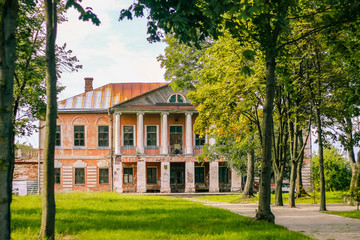 Beautiful old house and tower on a background of blue sky