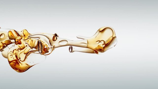 transparent orange gold oil bubbles and fluid shapes in purified water on a white gradient background. Side angle with crystal colored bubbles in purified cosmetic water backdrop with copy space for s