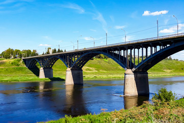 Fototapeta na wymiar Huge metal railway bridge across the river