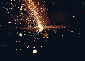 Sparks and flame on a black background