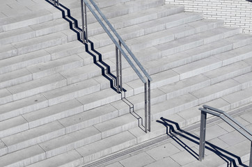 Aerial view of polished concrete stairs with metal handrails