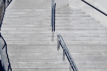 Aerial view of polished concrete stairs with metal handrails