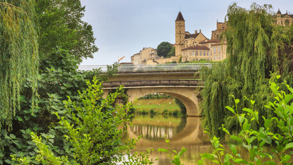 Summer city landscape - view of the bridges over the River Gers in the town of Auch, in the historical province Gascony, the region of Occitanie of southwestern France - obrazy, fototapety, plakaty