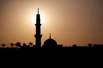 outlines of a mosque at orange sunset